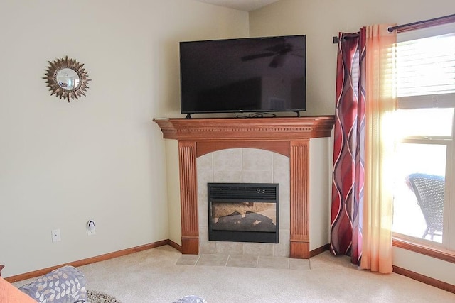 details with carpet flooring, a tiled fireplace, and baseboards