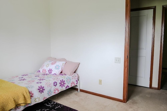 carpeted bedroom with baseboards