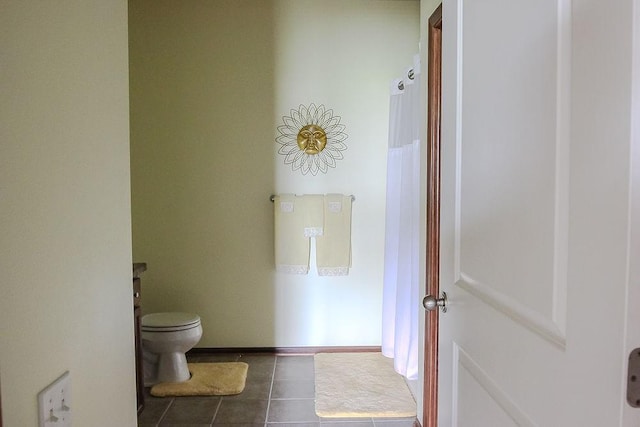 bathroom featuring tile patterned floors and toilet