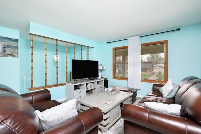 living room featuring baseboards