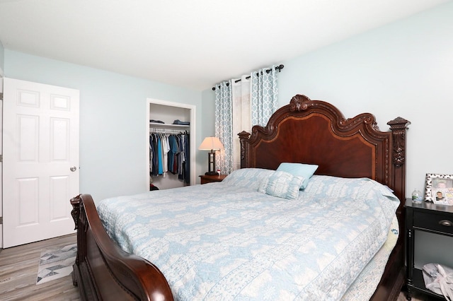bedroom featuring a closet and wood finished floors
