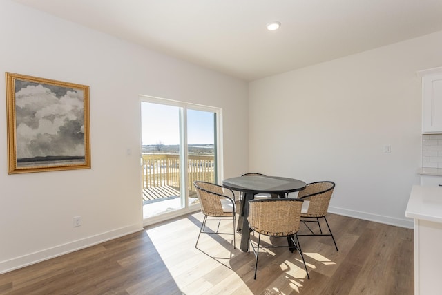 935 11th St, Waukee, IA 50263 - dining space with light wood finished floors and recessed lighting