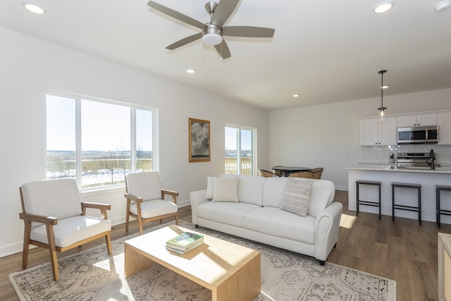 935 11th St, Waukee, IA 50263 - living room featuring recessed lighting, light wood finished floors, and a ceiling fan