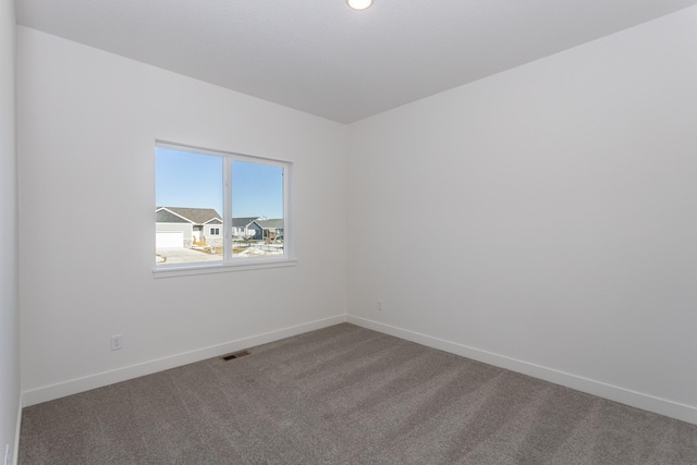 935 11th St, Waukee, IA 50263 - empty room with carpet and baseboards