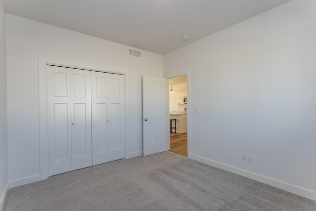 935 11th St, Waukee, IA 50263 - unfurnished bedroom with carpet flooring and a closet