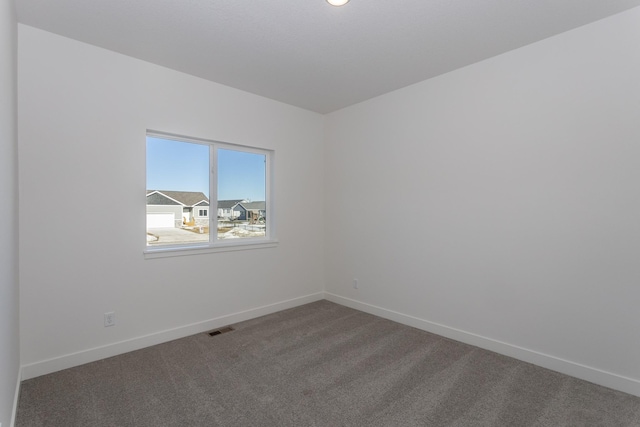 935 11th St, Waukee, IA 50263 - carpeted spare room with baseboards