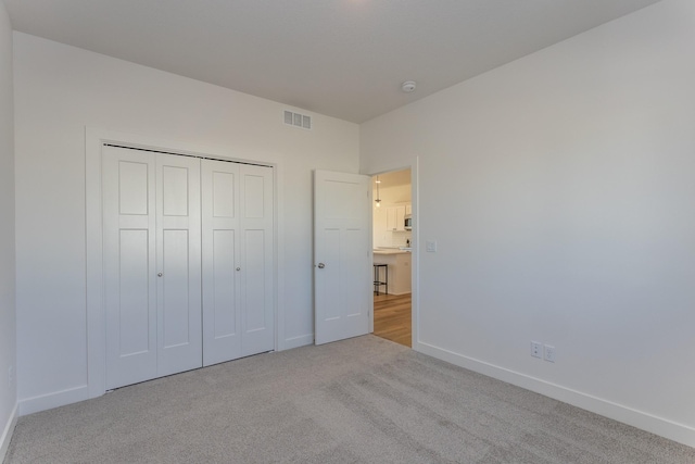 935 11th St, Waukee, IA 50263 - unfurnished bedroom with carpet and a closet