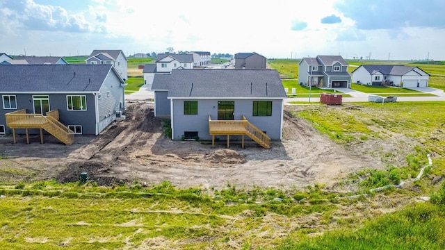 935 11th St, Waukee, IA 50263 - back of property with stairway, a residential view, and a deck