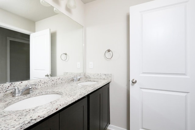 4207 NW Cedarwood Dr, Ankeny, IA 50023 - bathroom featuring double vanity and baseboards