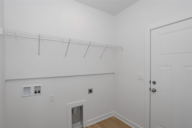 955 11th St, Waukee, IA 50263 - laundry area with hookup for an electric dryer, washer hookup, light wood-style flooring, and baseboards