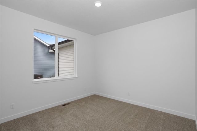 955 11th St, Waukee, IA 50263 - carpeted empty room featuring baseboards