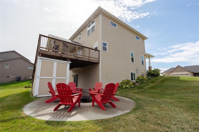 back of house featuring a lawn, a deck, and a patio area