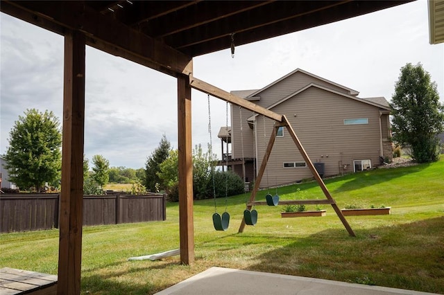 view of play area with a yard and fence
