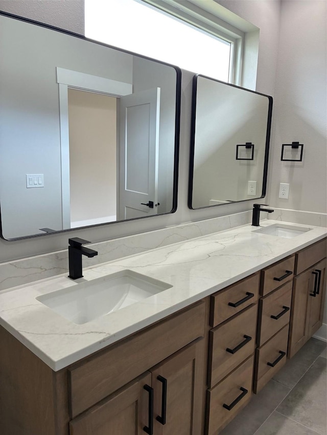 bathroom with a sink and double vanity