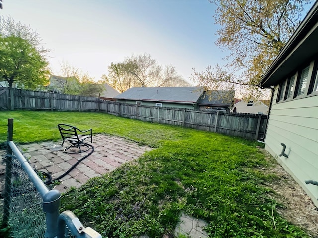view of yard featuring a fenced backyard and a patio area