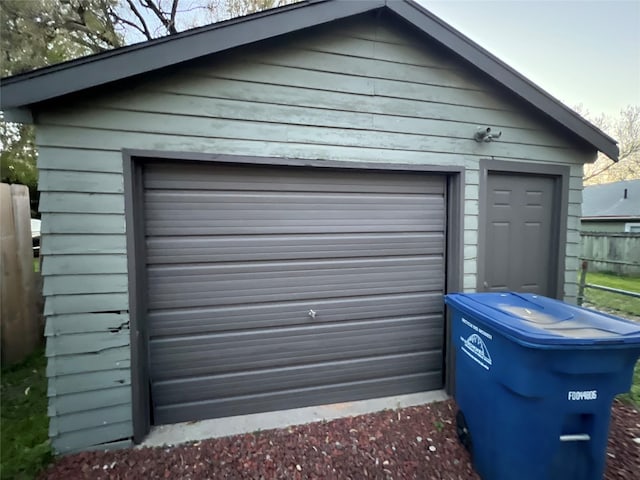 garage with fence