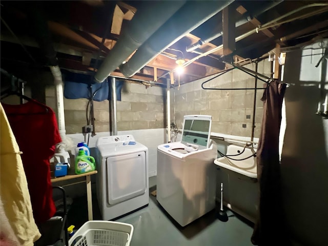 washroom featuring washer and dryer and laundry area