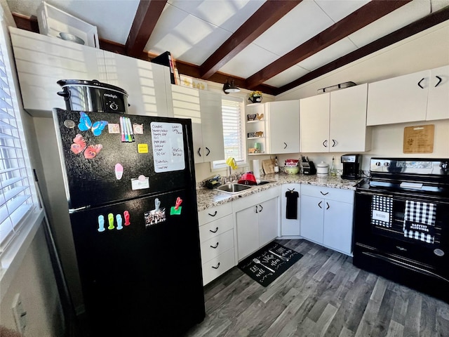 2216 Lay St, Des Moines, IA 50317 - kitchen featuring black appliances, open shelves, white cabinetry, dark wood-style floors, and light countertops