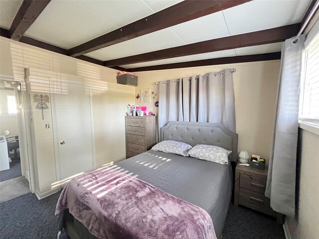 2216 Lay St, Des Moines, IA 50317 - bedroom with carpet floors and beam ceiling