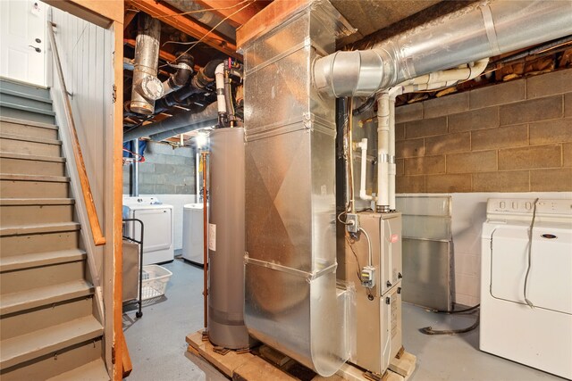 2216 Lay St, Des Moines, IA 50317 - unfinished basement with independent washer and dryer, stairway, and water heater