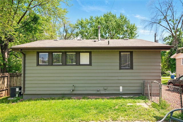 2216 Lay St, Des Moines, IA 50317 - rear view of property with central AC unit