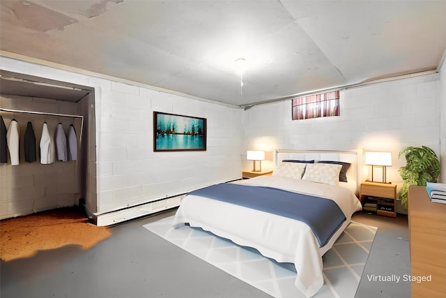 2216 Lay St, Des Moines, IA 50317 - bedroom featuring finished concrete floors and concrete block wall