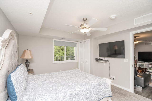4837 86th St Unit 17, Urbandale, IA 50322 - bedroom with a ceiling fan, baseboards, a closet, and visible vents
