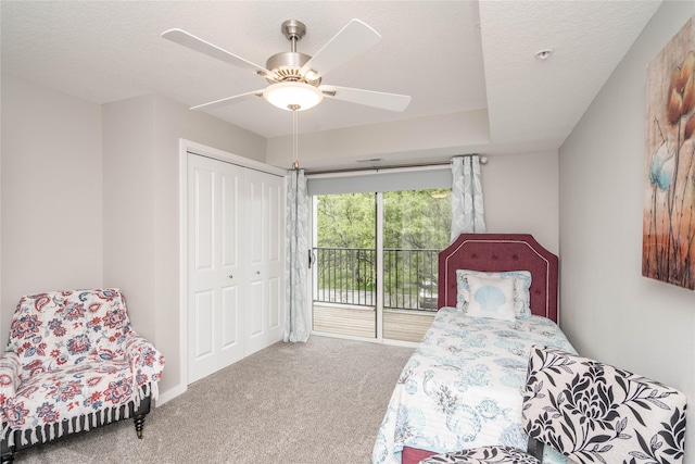 4837 86th St Unit 17, Urbandale, IA 50322 - bedroom featuring ceiling fan, carpet flooring, access to outside, and a closet