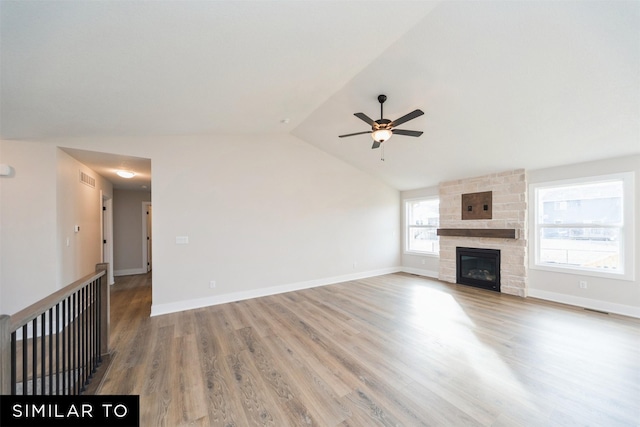 unfurnished living room featuring vaulted ceiling, visible vents, ceiling fan, and wood finished floors