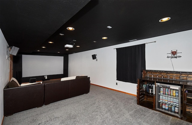 carpeted home theater room featuring baseboards, visible vents, and recessed lighting