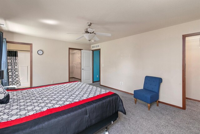 5301 SE 27th St, Des Moines, IA 50320 - bedroom featuring baseboards, carpet, a walk in closet, ceiling fan, and a closet