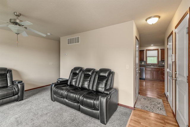 5301 SE 27th St, Des Moines, IA 50320 - living room with a ceiling fan, wood finished floors, and baseboards