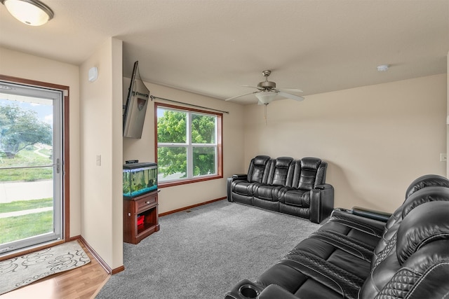 5301 SE 27th St, Des Moines, IA 50320 - living room featuring baseboards, ceiling fan, and carpet floors