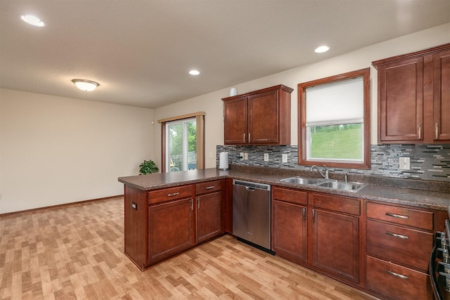 5301 SE 27th St, Des Moines, IA 50320 - kitchen featuring stainless steel dishwasher, a sink, a peninsula, dark countertops, and recessed lighting