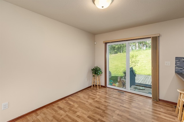 5301 SE 27th St, Des Moines, IA 50320 - empty room with light wood-type flooring and baseboards