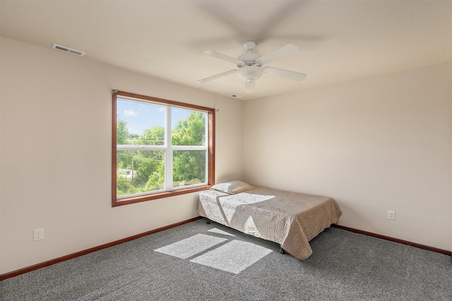 5301 SE 27th St, Des Moines, IA 50320 - carpeted bedroom with baseboards and ceiling fan