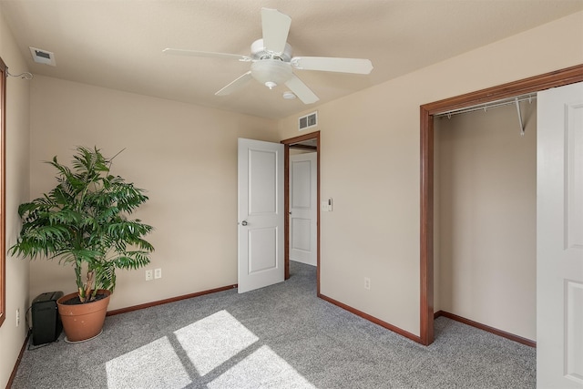 5301 SE 27th St, Des Moines, IA 50320 - unfurnished bedroom with carpet flooring, baseboards, a ceiling fan, and a closet