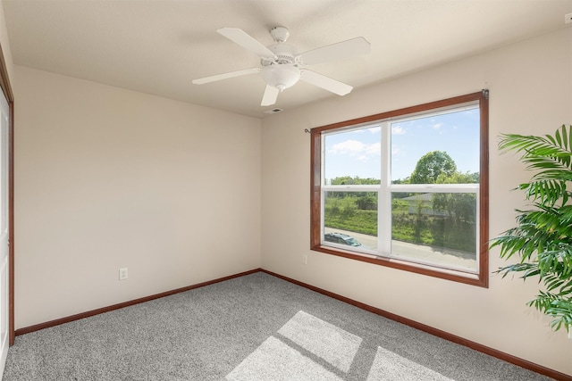 5301 SE 27th St, Des Moines, IA 50320 - carpeted empty room featuring baseboards and ceiling fan
