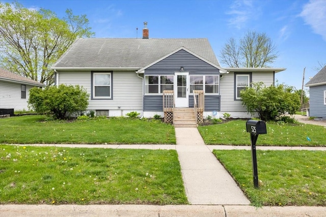 525 SW Walnut St, Ankeny, IA 50023 - bungalow-style home with a shingled roof, a chimney, and a front yard