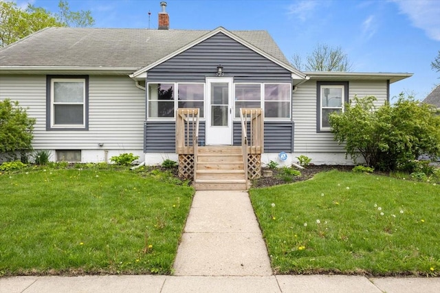 525 SW Walnut St, Ankeny, IA 50023 - view of front of property featuring a front lawn, a chimney, a sunroom, and a shingled roof