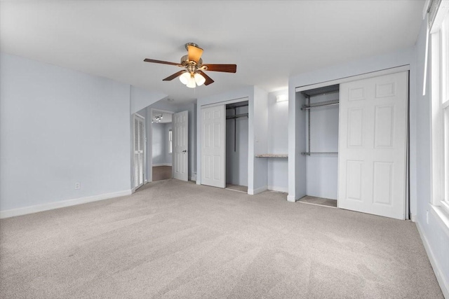 525 SW Walnut St, Ankeny, IA 50023 - unfurnished bedroom with ceiling fan, baseboards, multiple closets, and carpet floors