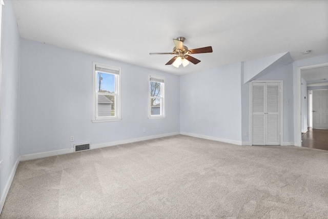525 SW Walnut St, Ankeny, IA 50023 - unfurnished room with ceiling fan, carpet flooring, baseboards, and visible vents