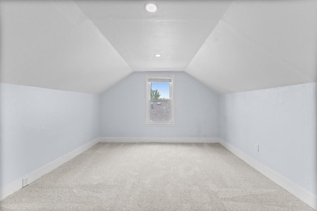 525 SW Walnut St, Ankeny, IA 50023 - bonus room featuring vaulted ceiling, carpet, and baseboards