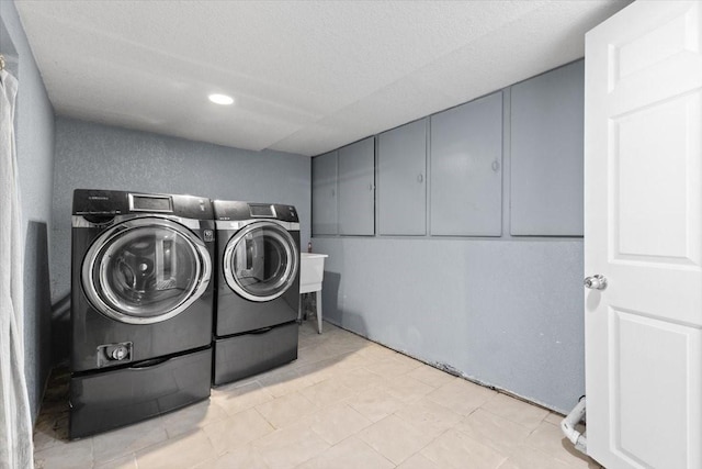 525 SW Walnut St, Ankeny, IA 50023 - laundry area featuring washer and clothes dryer, laundry area, a textured ceiling, and recessed lighting