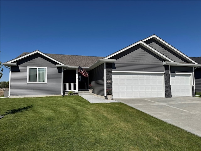 2708 NW Boulder Point Pl, Ankeny, IA 50023 - single story home featuring a porch, concrete driveway, an attached garage, and a front lawn