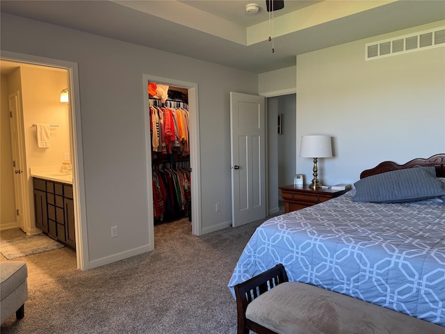 2708 NW Boulder Point Pl, Ankeny, IA 50023 - carpeted bedroom with a closet, visible vents, baseboards, ensuite bath, and a spacious closet