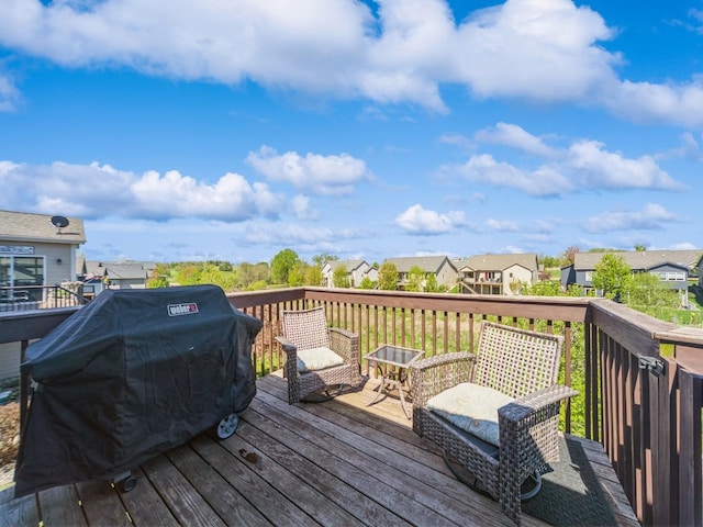 deck featuring a grill and a residential view