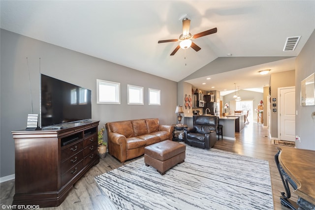 4522 145th St, Urbandale, IA 50323 - living area with plenty of natural light, a ceiling fan, visible vents, and light wood-style floors