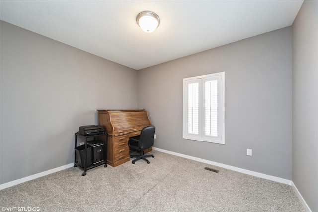 4522 145th St, Urbandale, IA 50323 - home office featuring visible vents, baseboards, and light carpet