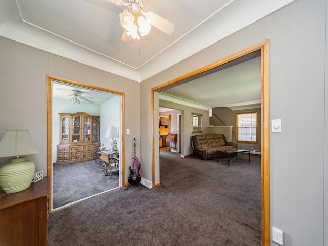 interior space with carpet and baseboards